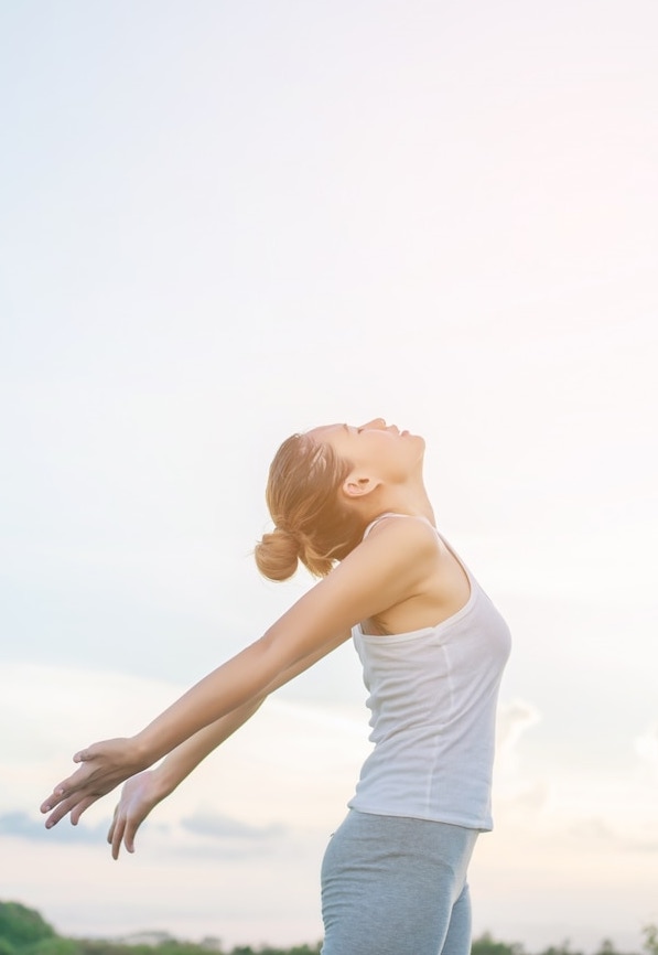 concentrated-woman-stretching-her-arms-with-sky-background_1150-376 Microneedeling in Mossel Bay and George